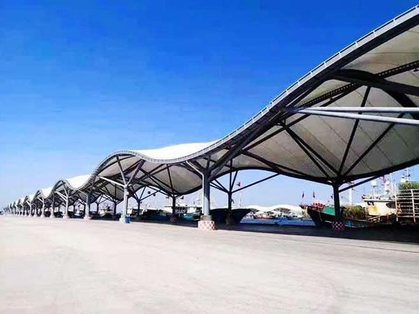 Fabric covered corridor tensile structure