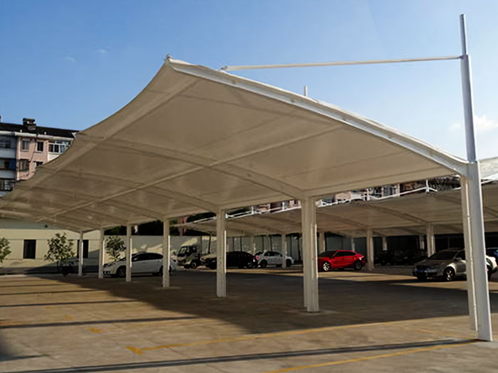 What are the advantages of tensile fabric structure vs traditional building?