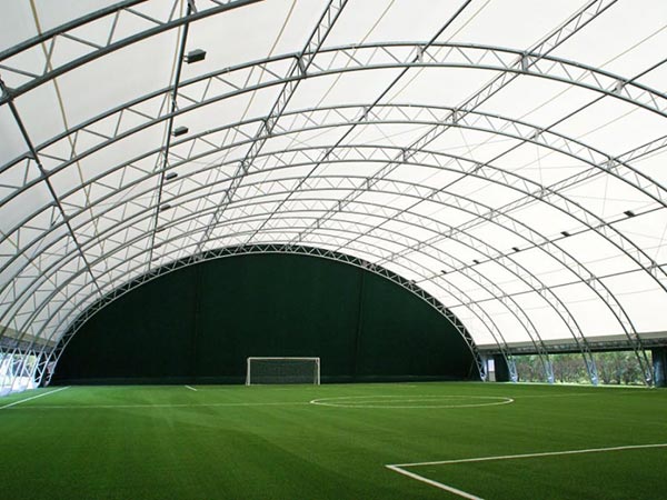 Fabric covering tensile structure for football stadium