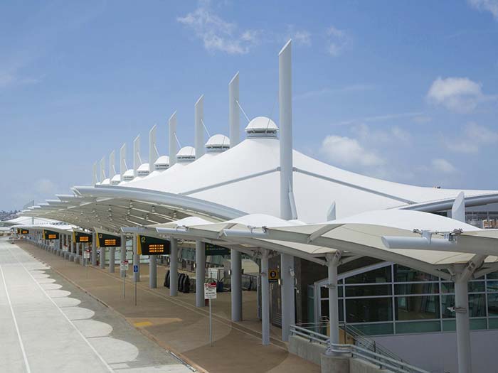 Tensile fabric canopy structure for airport terminal docking station